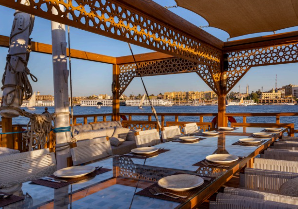 Shaded deck dining overlooking the Nile