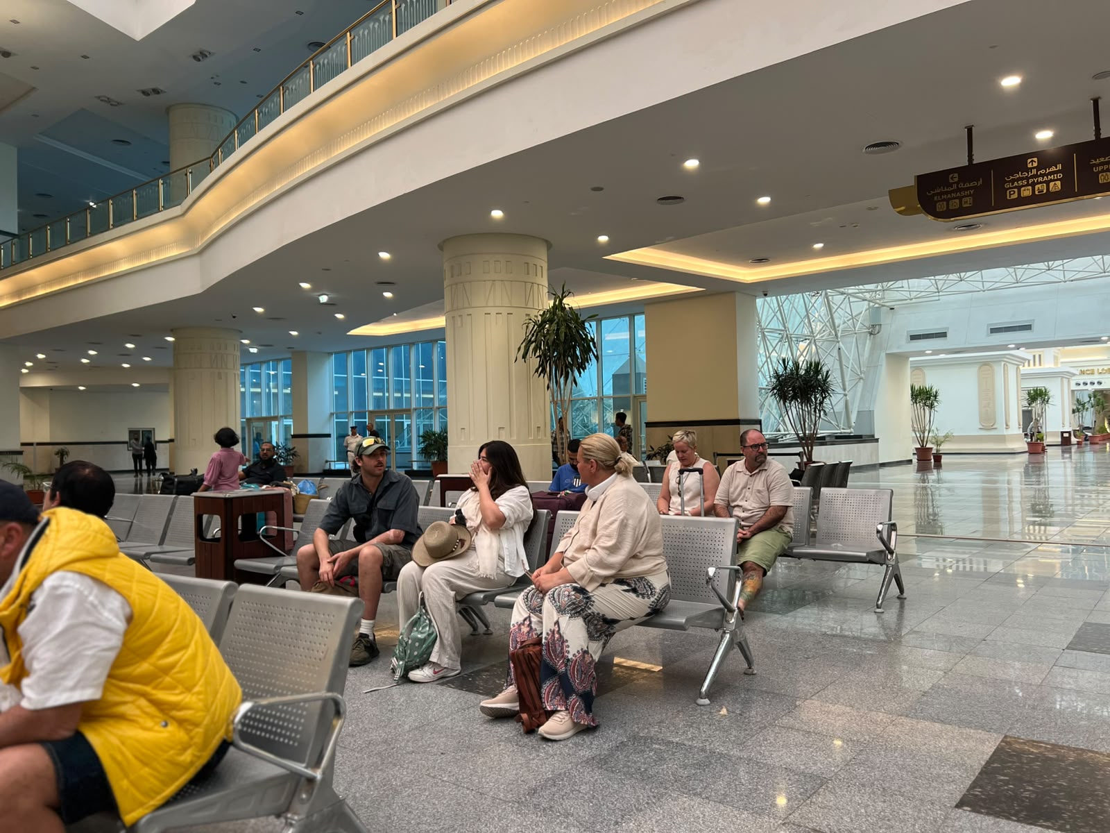 Travellers waiting in the Abela railway station lounge